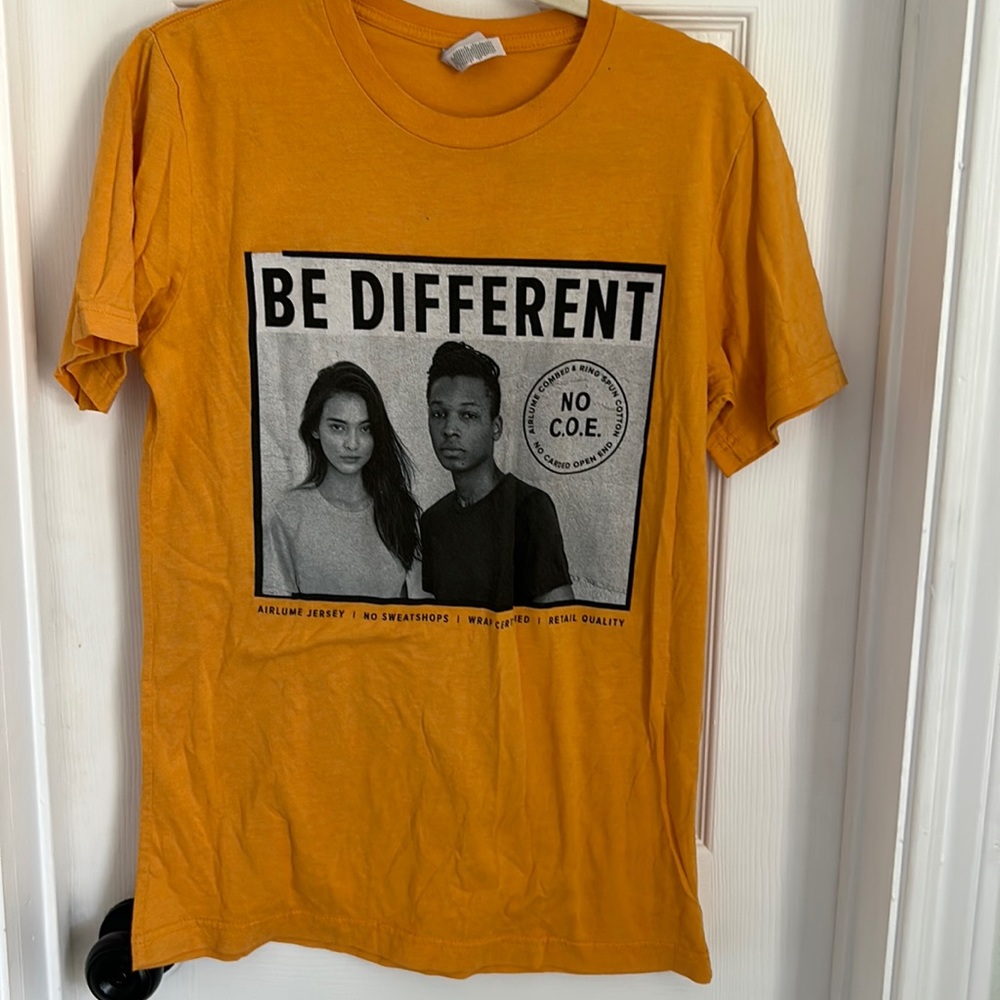 Graphic tee just wrinkled no tear or marks good shirt just needs ironing